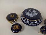 a blue and gold box and other items on a white surface