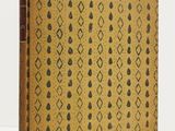an old book with a pattern on the cover