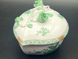 an image of a green and white box with flowers on it