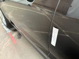 a close up of a car door with a sticker on it