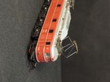 a toy train that is sitting on a black surface