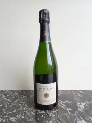 a close up of a bottle of wine on a table
