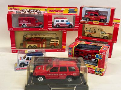 four toy firetrucks that are in a display case