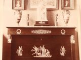 an old photo of a chest of drawers in a room