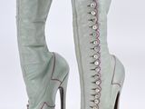 an image of a pair of women ' s boots with laces on them