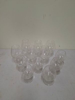 a lot of empty wine glasses sitting on a table