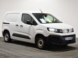 the white van is parked in a room with a checkered floor