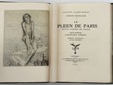 un livre ouvert sur lequel figure le dessin d'une femme nue assise sur un rocher