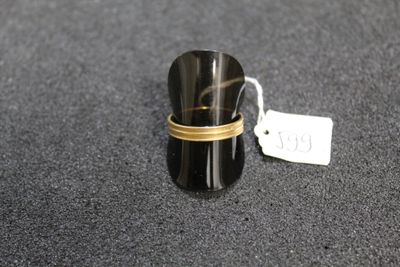 a close up of a ring on a table with a price tag