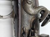 a close up of a gun that is on display