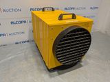 a yellow heater sitting on top of a floor next to a wall