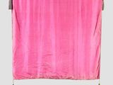 an image of a pink curtain with tassels hanging from it