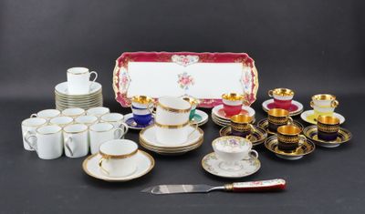 many different types of coffee cups and saucers on the table