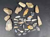 several pieces of rock are arranged in a circle on a black surface