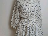 an image of a dress on a mannequin stand