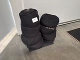 pair of black boots sitting on top of a wooden floor