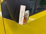 a yellow car with a measuring tape on the side of it
