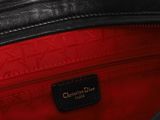 a close up view of the inside of a black and red handbag