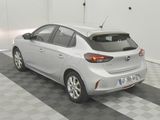 a white car parked in a garage with a checkered floor