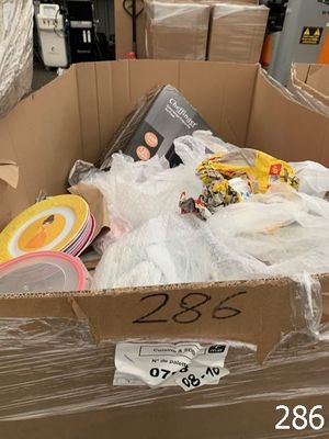 a cardboard box full of assorted items in a store