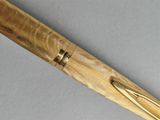 a close up of a pen with a wooden handle