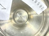 a silver plate with a price tag on it