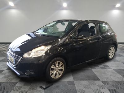 the small black car is parked in the garage on a checkered floor