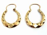 pair of gold tone hoop earrings with geometric design on white background