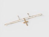 a pair of gold cross hair pins on a white background