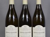 three bottles of wine sitting on top of a table next to each other