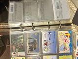 a lot of cards in the case on the table