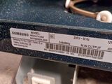 a close up of the back of a microwave with a barcode on it