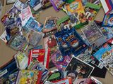 a cardboard box full of comic books on the floor