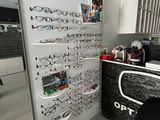 a wall of glasses on the wall in the room