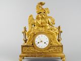 an image of a gold clock with an angel sitting on top of it