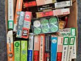 a box full of cigarettes and cigarettes on the floor