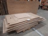 several pieces of cardboard are stacked on top of each other in a warehouse