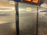 three stainless steel refrigerators in a commercial kitchen