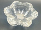 a clear glass bowl on a black table