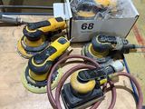 a group of power tools sitting on top of a wooden table
