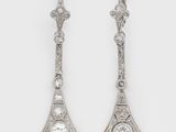 a pair of diamond and platinum - plated earrings