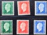 quatre timbres de couleurs différentes sur lesquels figurent des portraits d'hommes