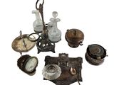 a lot of antique items that are sitting on a table