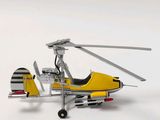 a model of a yellow helicopter on a white surface