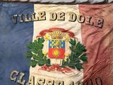 a large flag with a coat of arms and a coat of arms on it