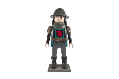 figurine Lego représentant un homme barbu portant un chapeau, sur fond blanc