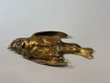 brass fish figurine on a white background