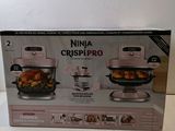 boxed box of the ninja crisp pro food processor is on the table
