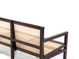 a wooden bench with a rattan seat on it