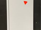 a white refrigerator with a red triangle on the door